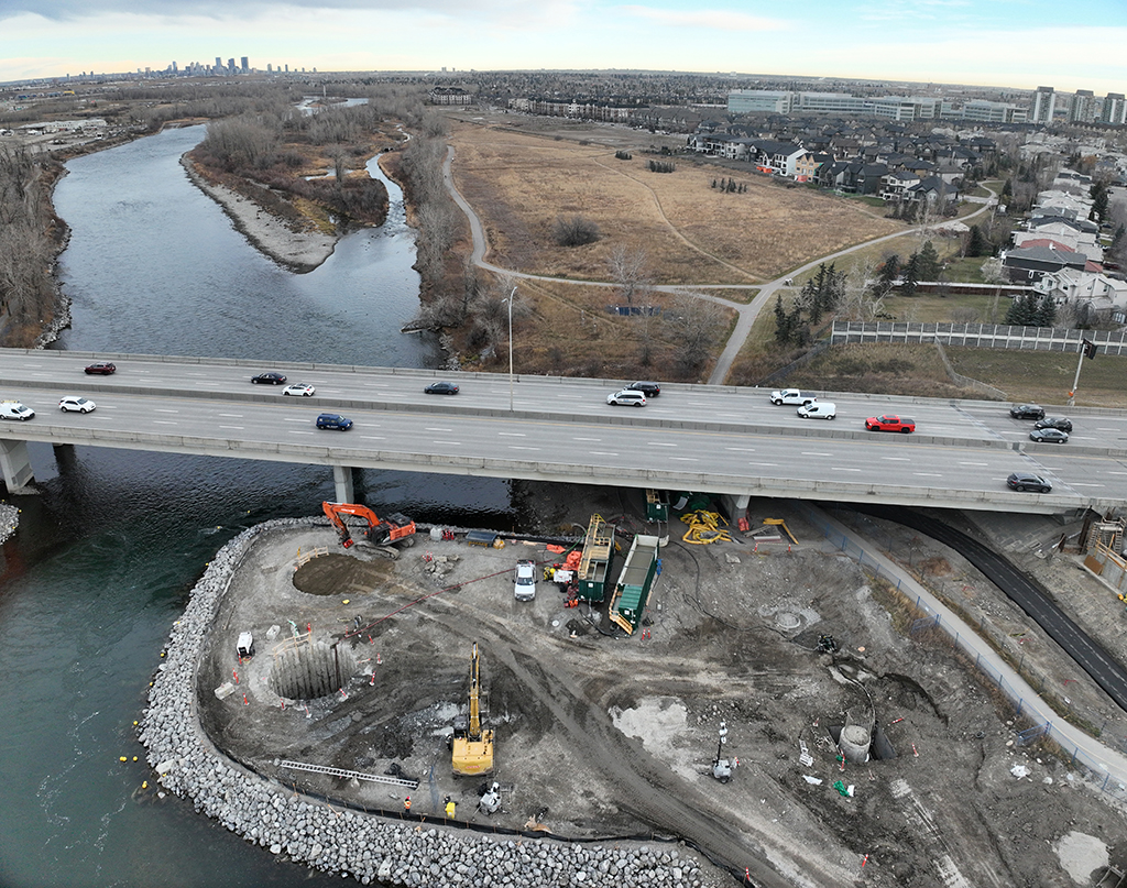 A cofferdam is a watertight enclosure that allows construction work below the waterline; two cofferdams are being installed on the east side of the river for bridge pier construction, November 14, 2024.